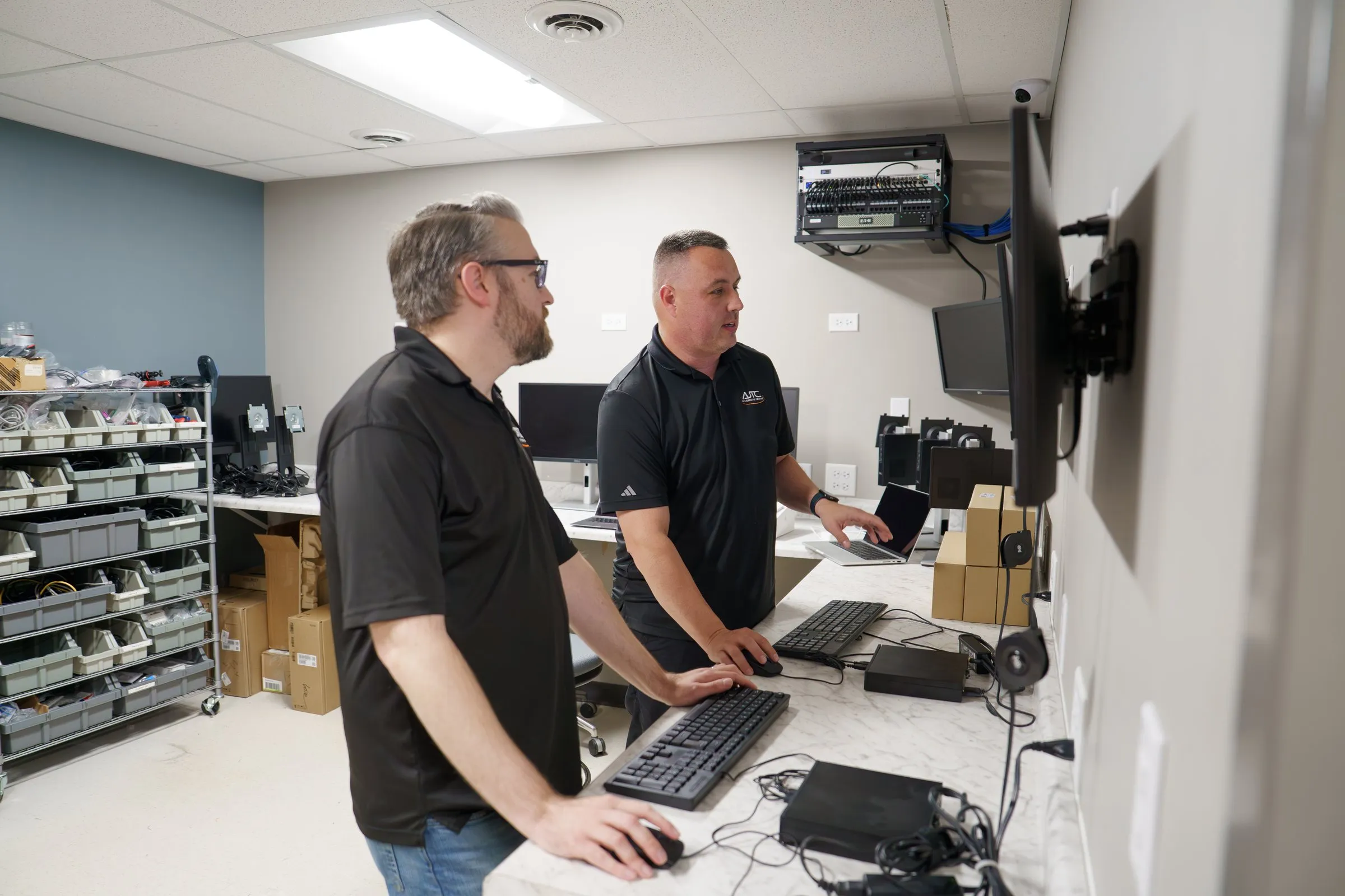CJ and Chris preparing equipment in the AJTC Chicago equipment room
