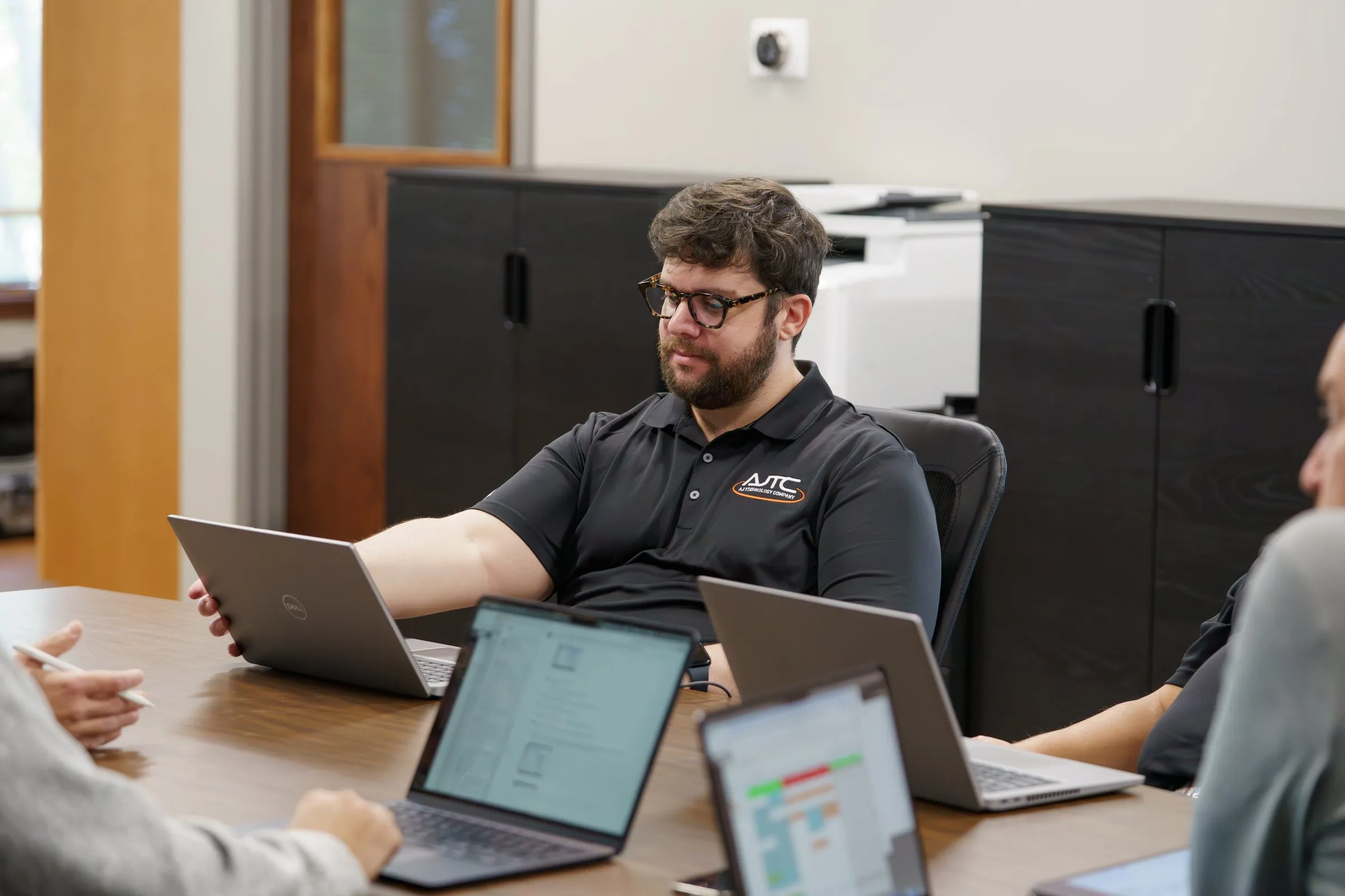 Nick from AJTC leading a project management meeting