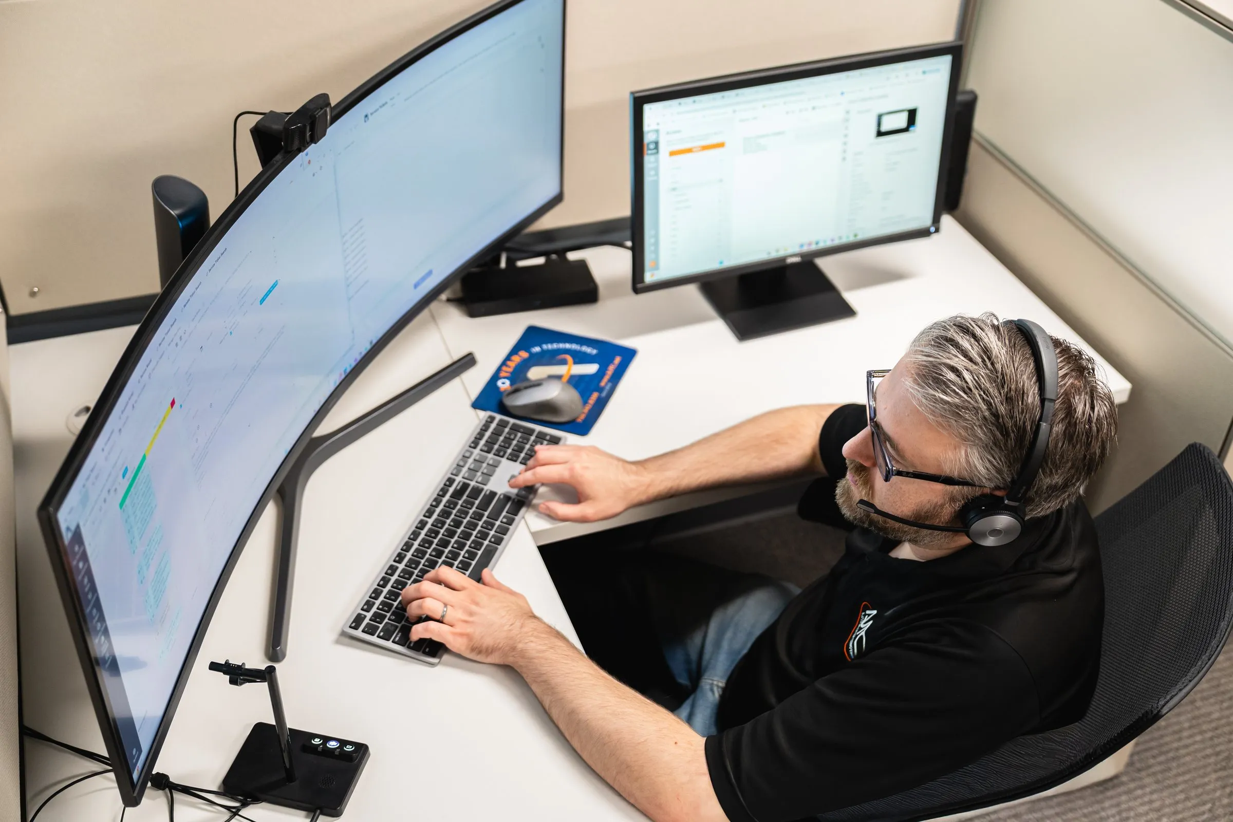 AJTC technician working support requests at the service desk