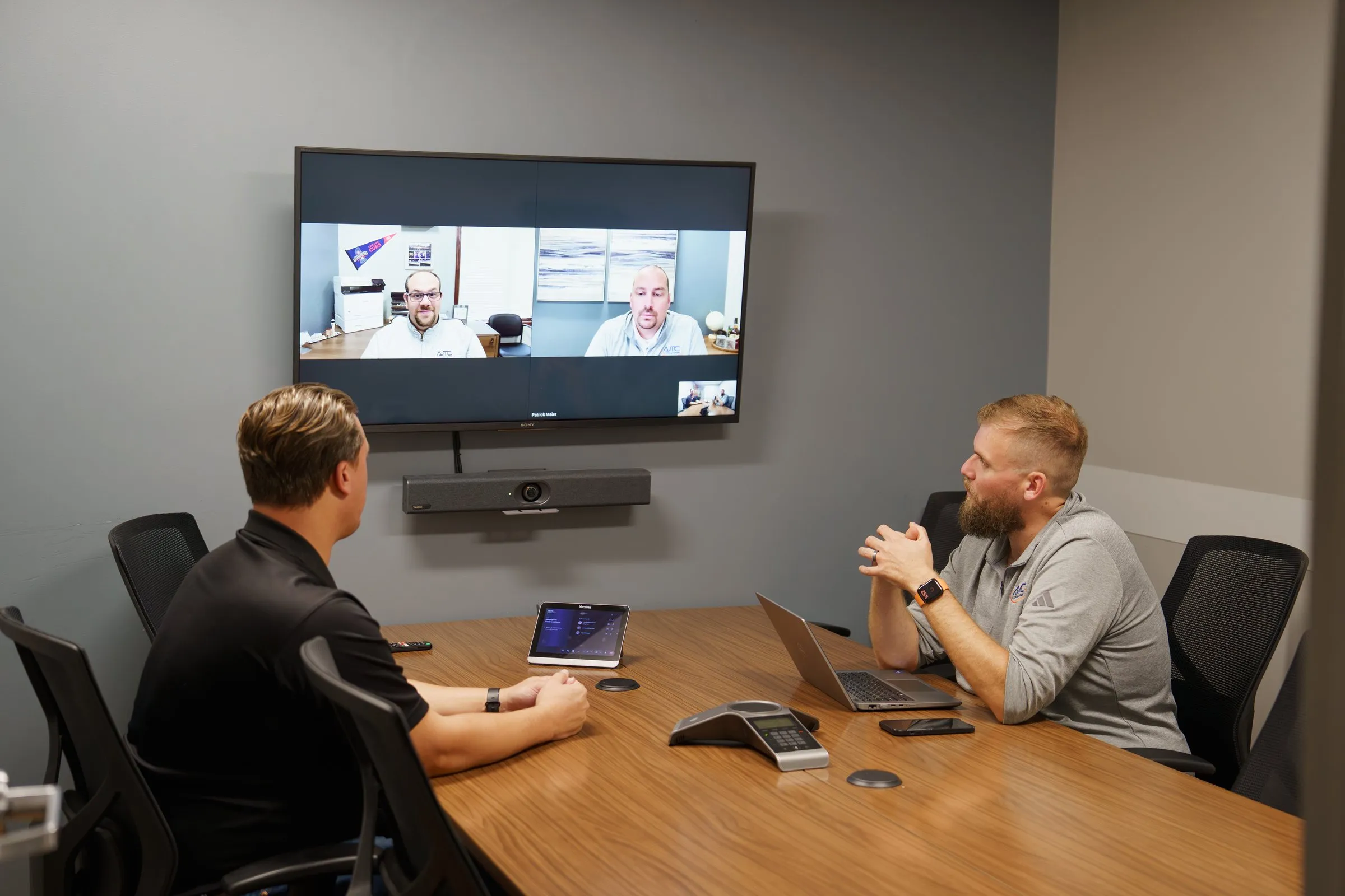 AJTC team on a Microsoft Teams video call in the conference room