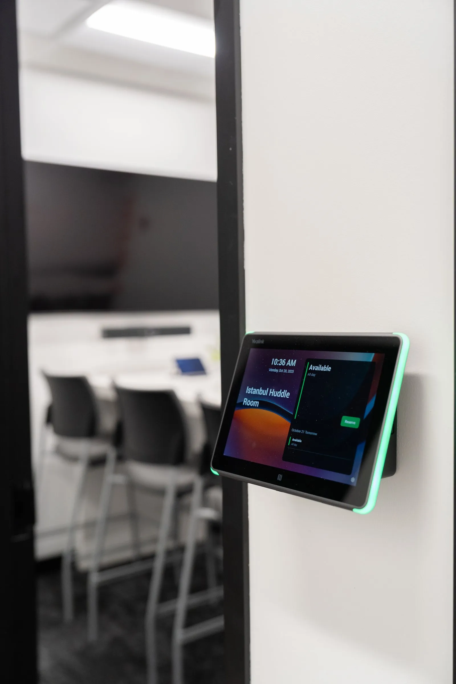 Microsoft Teams room booking panel outside a conference room set up by AJTC
