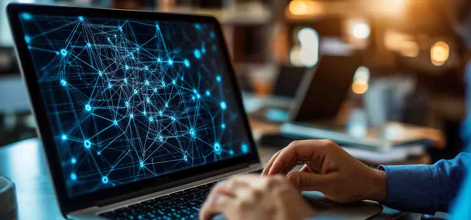 Network design tools types – IT engineer creating a network diagram on a laptop screen