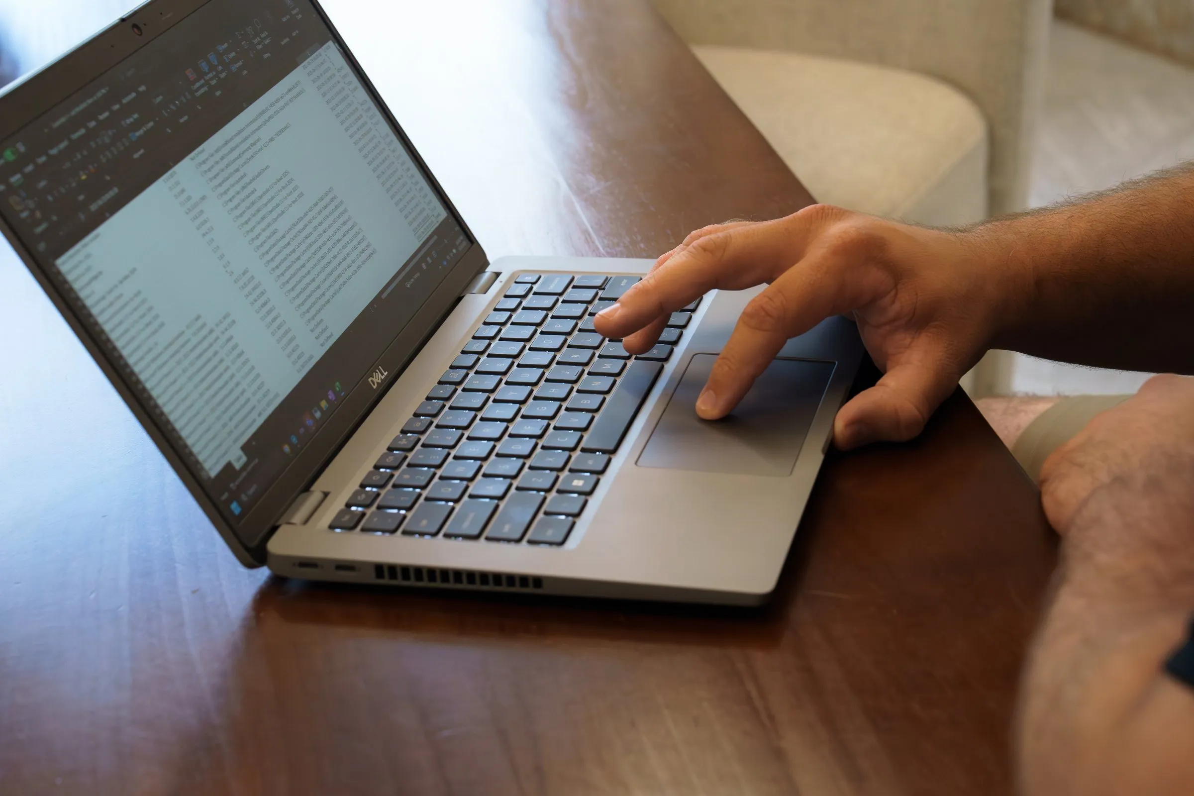 AJTC developer working on a laptop
